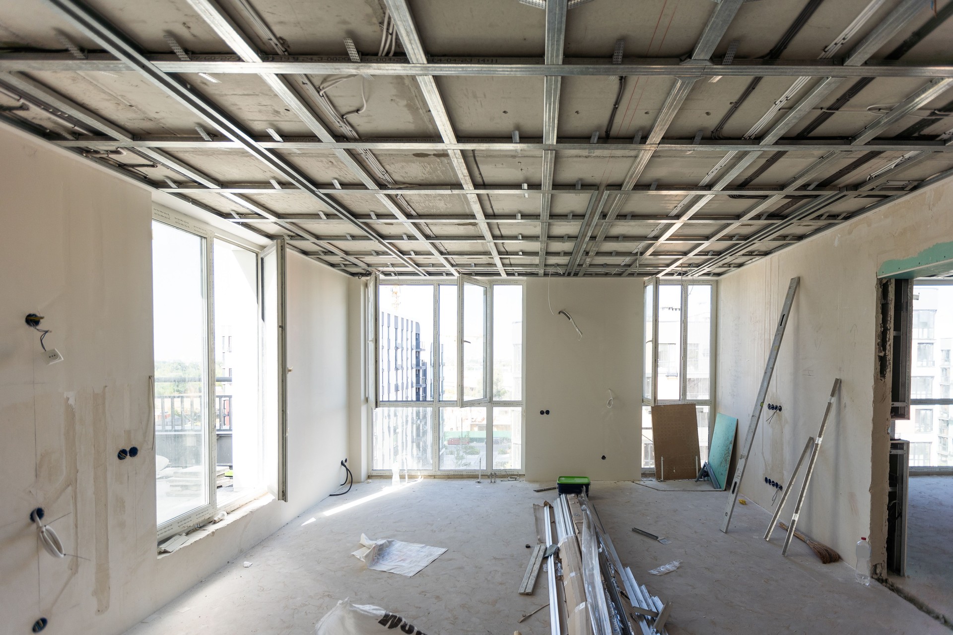 Drywall installation work in progress by construction workers at construction room. easiest and cheapest way to do partition for interior wall. New home for under construction. protection building